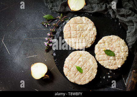 Black burger on stone cutting board Stock Photo by DC_Studio