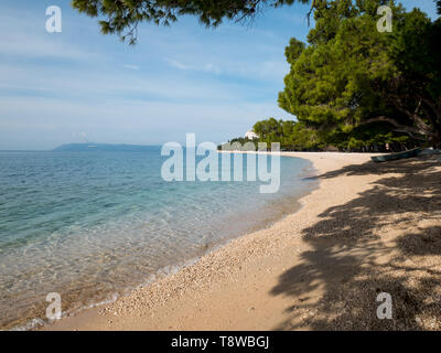 Empty beach and calm blue sea in Tucepi, Croatia Stock Photo
