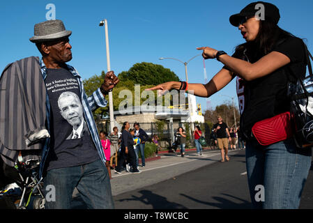 People seen having fun during the festival. People gather at a festival celebrating the renaming of Rodeo Road to Obama Boulevard, in honor of former US President Barack Obama in Los Angeles, California. Stock Photo