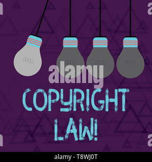 Writing note showing Copyright Law. Business concept for body of law that governs the original works of authorship Color Pendant Bulb Hanging with One Stock Photo