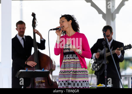 Live music performed on stage by instrumentalists' group & female singer singing into microphone - RHS Chatsworth Flower Show, Derbyshire, England, UK Stock Photo