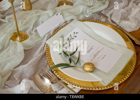Rustic wedding table set. vintage dining table with decorations, flowers. Boho style. Table set for an event, party, date or wedding Stock Photo