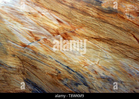 Natural stone, marble texture in yellow with gray streaks and stripes, beautiful background. Stock Photo