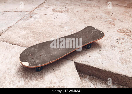 Old worn skateboard sports equipment with copy space Stock Photo