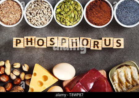 Organic phosphorus sources. Foods highest in phosphorus as liver, sardines, cheese, peanuts, pumpkin seeds, cocoa, poppy seeds, sunflower seeds, bran  Stock Photo