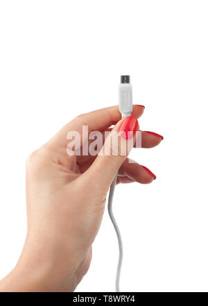 Hand holding USB cable. Female hand holding charging cable. Isolated on white background Stock Photo