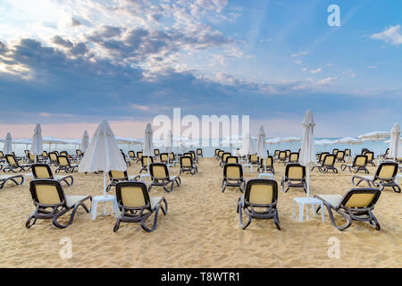 Chairs and umbrellas on a beautiful beach at sunrise in Sunny Beach on the Black Sea coast of Bulgaria. Stock Photo