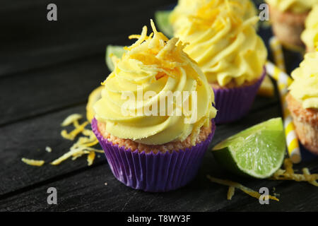 Delicious lemon cupcakes on wooden table, closeup Stock Photo
