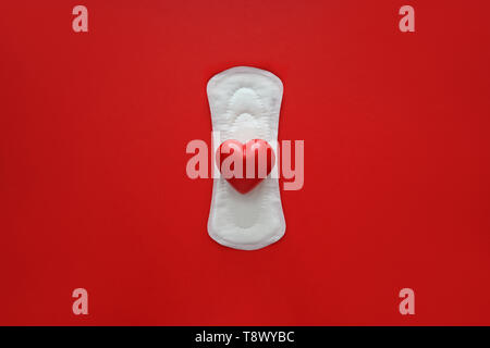 Red Hearts And Daily Menstrual Woman Pad For Hygiene Or Blood Period On  Pink Background Stock Photo - Download Image Now - iStock