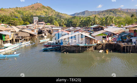 Aerial view Coron city with slums and poor district. Palawan.Wooden houses near the water.Poor neighborhoods and slums in the city of Coron aerial view Stock Photo