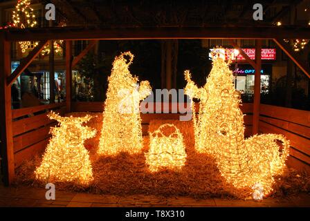 Christmas nativity made from white LED lights in the Plaza de la Constitucion at night, Fuengirola, Costa del Sol, Spain. Stock Photo