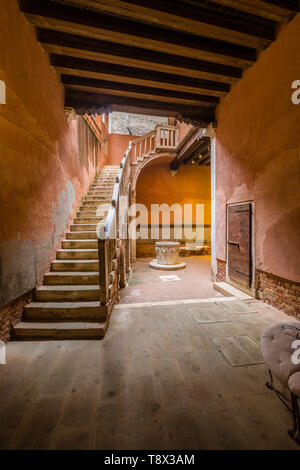 Inner courtyard of a terracotta color painted house of the so-called 'Floating city' Stock Photo