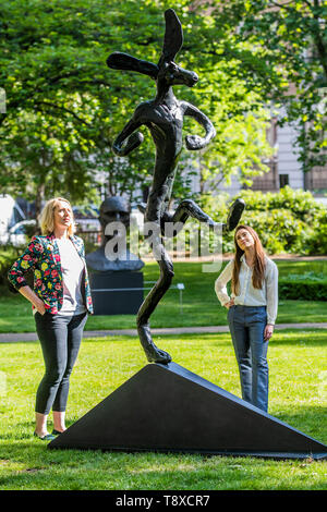 London, UK. 15th May, 2019. Barry Flanagan, The Bowler (1990, estimate: £600,000-800,000) with, in the background Dame Elizabeth Frink, In Memoriam I, 1981, est £200-300,000 - Christie’s Sculpture in the Square, an outdoor sculpture garden set within St James’s Square, London, on view to the public from 15 May to 17 June 2019. Credit: Guy Bell/Alamy Live News Stock Photo