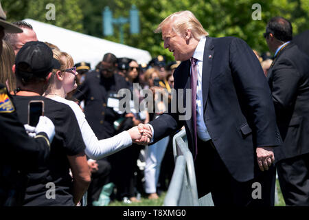 Washington, United States Of America. 15th May, 2019. United States President Donald J. Trump greets audience members during the 38th annual National Peace Officers' Memorial Service, at the U.S. Capitol in Washington, DC on May 15, 2019. Credit: Kevin Dietsch/Pool via CNP | usage worldwide Credit: dpa/Alamy Live News Stock Photo