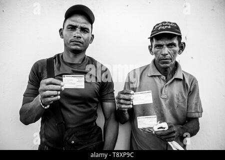 Pacaraima, Brazil. 12th Sep, 2018. Venezuelans are waiting for food to be distributed at one of the church&#3reception ion centers in Boa Vista, Roraima. Credit: Fernando Cabrera/FotoArena/Alamy Live News Stock Photo