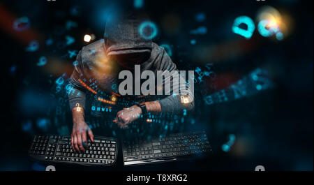 Hacker in hoodie dark theme Stock Photo