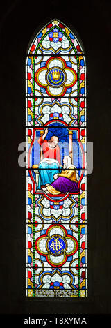 Stained glass window depicting Mary at the feet of Jesus Christ by Clayton and Bell 1872 in church of Saint Mary, Potterne, Wiltshire, England, UK Stock Photo