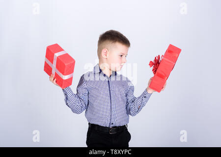 Holiday shopping seasonal sale. Wellbeing and positive emotions. Celebrate new year valentines day. Birthday gift. Birthday boy. Buy gifts. Child little boy hold gift box. Christmas or birthday gift. Stock Photo
