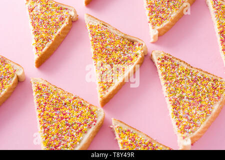 Traditional Australian fairy bread pattern on pink background Stock Photo