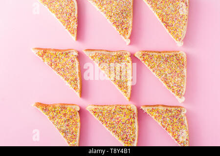 Traditional Australian fairy bread pattern on pink background Stock Photo