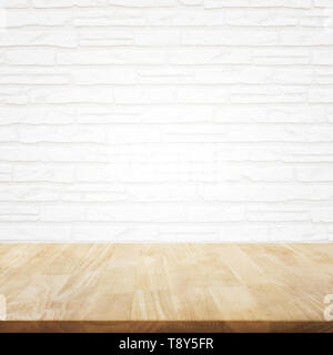 Empty wood table top with brick wall background. Stock Photo