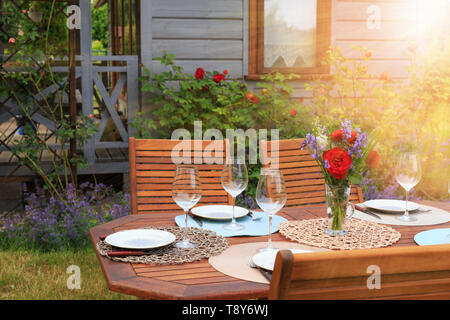 Image of a romantic table setting, for a wedding or garden party. Stock Photo