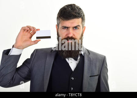 Businessman with beard holds credit card. Banker trust in safety and reliability of banking system. Banking concept. Man in formal suit holds plastic Stock Photo