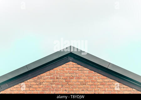 gable roof red brick house country style  concept idea against clear sky background missing home Stock Photo