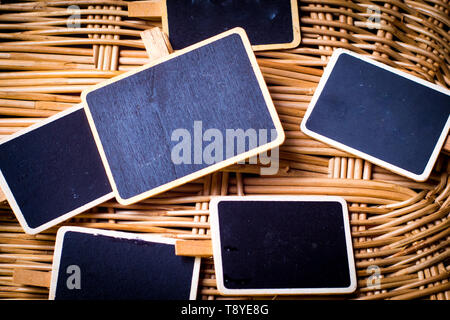 Blank small chalkboard with wooden frame on bamboo wooden nature idea background. for text.words. Stock Photo