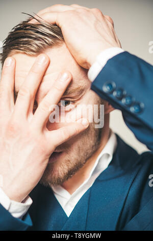 Painful memories. Guy hiding out of reality. Man serious unhappy hiding face while remembering bad embarrassed events from his past. Memories from Stock Photo