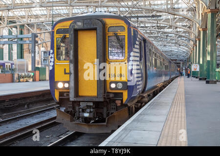 A Scotrail Class 156 diesel multiple unit train sits at platform 10 of Glasgow Central Station. Stock Photo