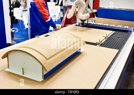 Milling and engraving center with automatic tool change for furniture in the factory Stock Photo