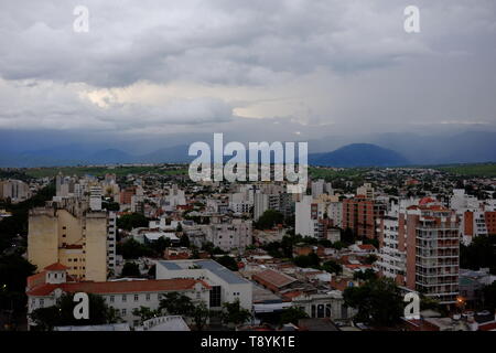 view over the city of Salta, Argentina in the Andes Mountains foothills, dark sky, storm brewing Stock Photo