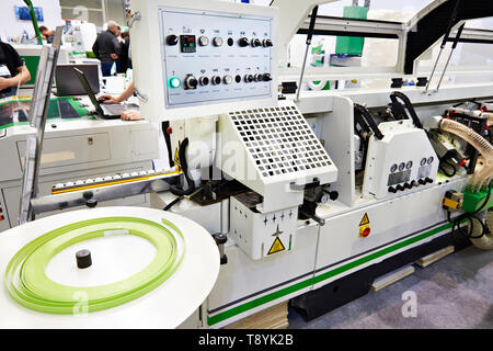 Single sided automatic edge banders CNC on factory Stock Photo