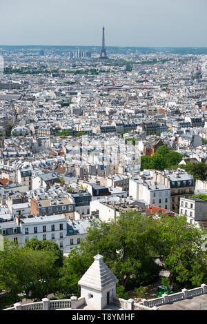 View of city skyline, with Eiffel Tower in distance, from top of Sacre-Coeur Basilica in Montmartre, Paris, France Stock Photo