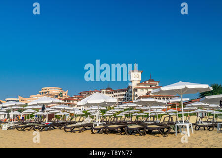Sunny Beach, Bulgaria - 2 Sep 2018: Umbrellas and chair lounges at Sunny Beach coastline, a major seaside resort on the Black Sea coast of Bulgaria. Stock Photo