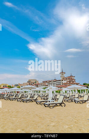Sunny Beach, Bulgaria - 5 Sep 2018: Umbrellas and chair lounges at Sunny Beach coastline, a major seaside resort on the Black Sea coast of Bulgaria. Stock Photo