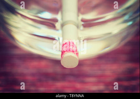 lipstick stained cigarette on ashtray Stock Photo