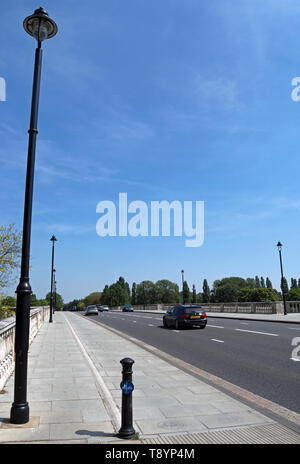 chiswick bridge, crossing the river thames, seen at low tide from ...