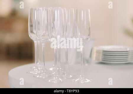 row of empty glasses on the restaurant table Stock Photo