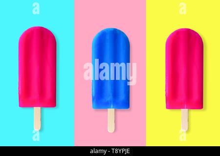 Collage of pink and blue summer popsicles on bright blue, pink and yellow background Stock Photo