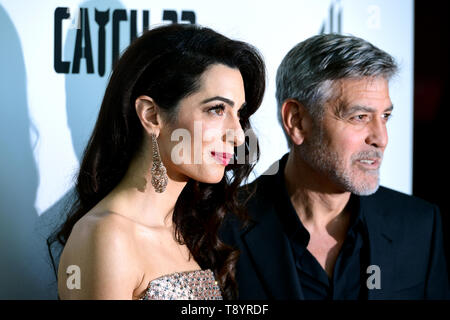 Amal Clooney (left) and George Clooney attending the Catch-22 UK Premiere, held at VUE Cinema Westfield, London. Stock Photo