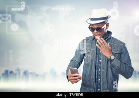 Young american african guy with cell phone. Handsome man. Device connecting people concept Stock Photo