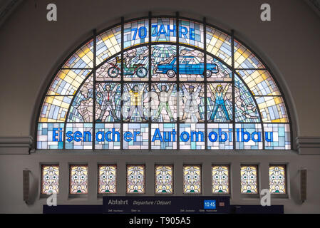 Eisenach, Germany - May 11, 2019: View of a lead glass window in Eisennach main station. It reminds of the automobile tradition, here the Wartburg was Stock Photo