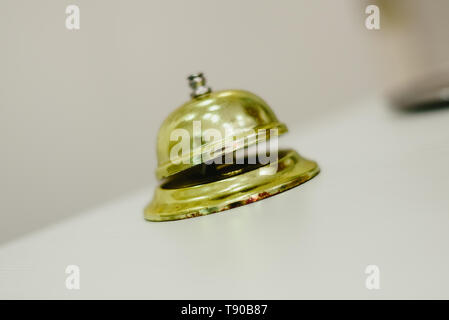 Old bell to call the bellman in a hotel, Service bell hotel golden. Stock Photo