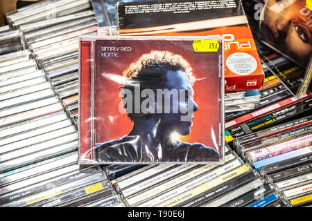 Nadarzyn, Poland, May 11, 2019: Simply Red HOME CD album on display for sale, famous British soul and pop band, lead singer Mick Hucknall, collection Stock Photo