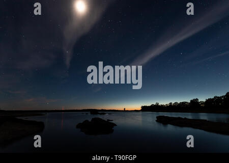 Night landscape with moon in the swamp of Valdesalor. Extremadura. Spain. Stock Photo