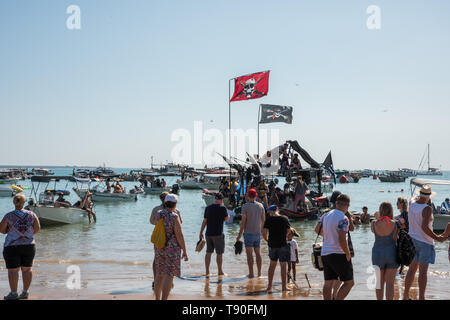 Darwin, Northern Territory, Australia-July 22,2018: Pirate themed boat and crowds at Mindil Beach during the Beer Can Regatta in Darwin, Australia Stock Photo