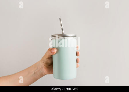 Reusable blue jar with metal straw for summer drinks. Individual use. Save the planet. Zero waste concept. Plastic free. Stock Photo