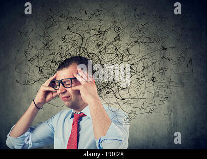 Thoughtful stressed young man with a mess in his head Stock Photo